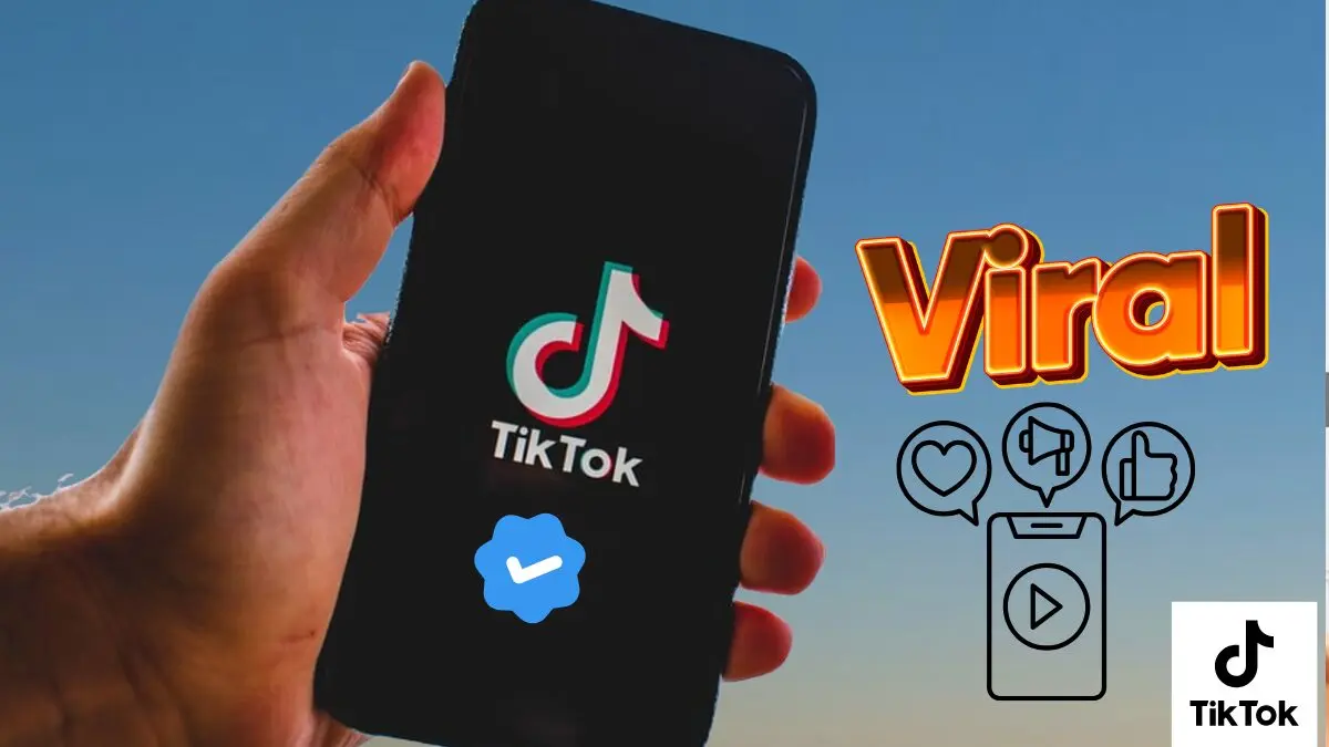 Foto de uma mão segurando um celular com o logotipo do TikTok e um selo azul de conta verificada, ao lado da palavra "Viral" escrita em letras grandes com ícones de engajamento.